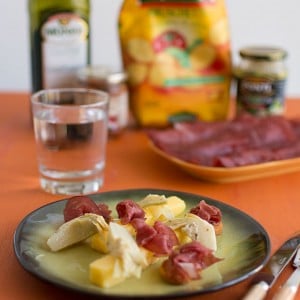 Recette d'Italie : polenta, artichauts, sauce arrabbiata, bresaola