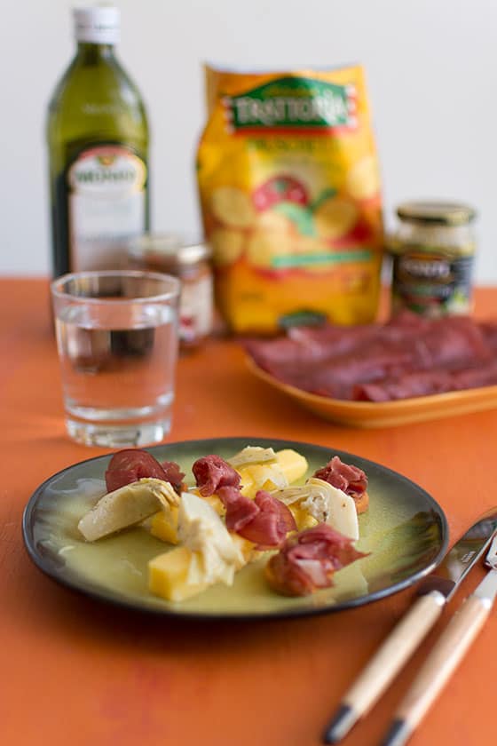 Recette d'Italie : polenta, artichauts, sauce arrabbiata, bresaola